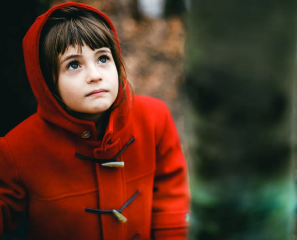 istock Child in red coat outdoors in autumn 1277836488