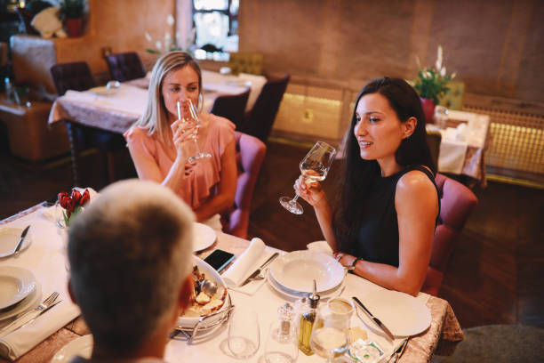 istock Friends dining in a nice restaurant 1277836817