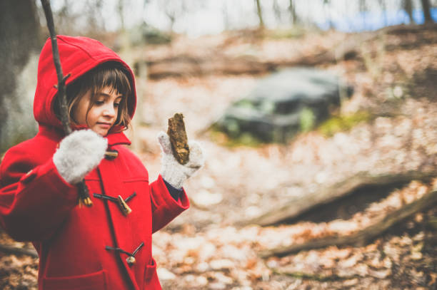 istock Child in red coat outdoors in autumn 1277837631