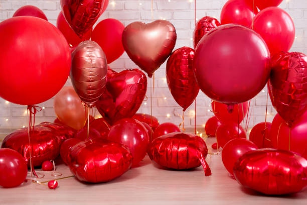 istock Valentine's day background - red circle and heart shaped balloons 1277841472