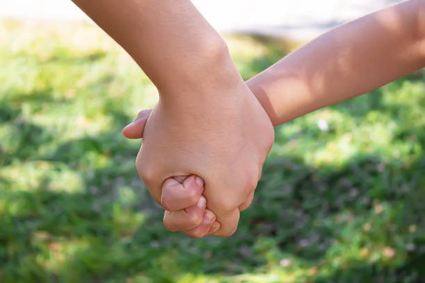 istock mom holding baby by the hand. selective focus 1277845689