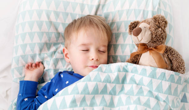 istock Child sleeping in the bed on pillow 1277846650
