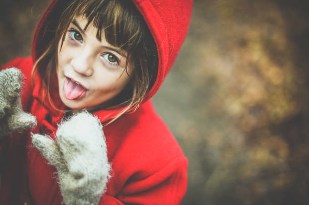 Mischievous child in a outdoor fall/winter portrait
