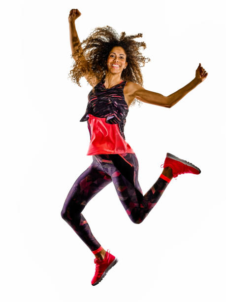 woman cardio dancer dancing fitness fitness exercises isolated white background one african mixed race mature woman cardio dancer dancing fitness exercises in studio isolated on white background zumba image stock pictures, royalty-free photos & images