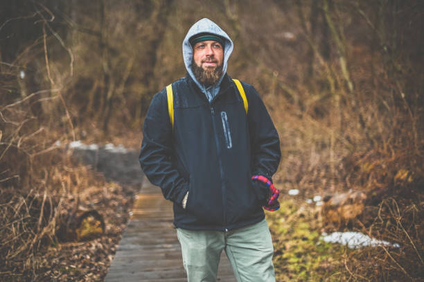Guy bundled up for cold weather on a winter walk