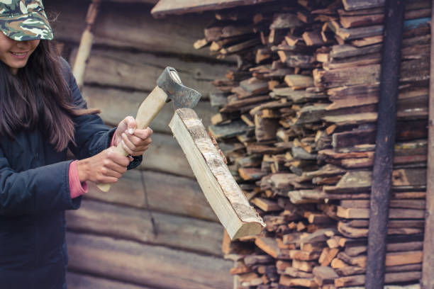 istock Girl chopping wood with axe 1277853757