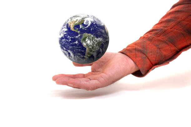 istock man hand with floating Planet Earth 1277855753
