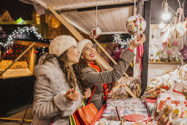 istock Two female friends on the Christmas market 1277856416