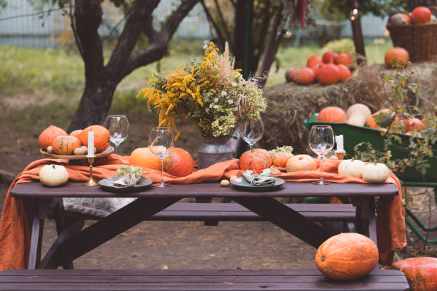 fall themed holiday table setting arrangement for a seasonal party, banner, toned - autumn table setting flower imagens e fotografias de stock