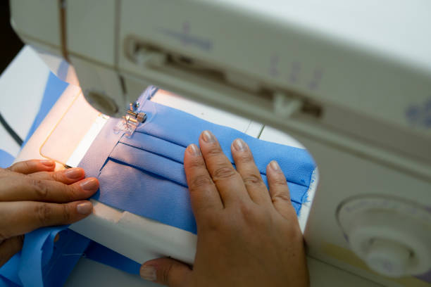 istock hands working to make medical mask. 1277862680