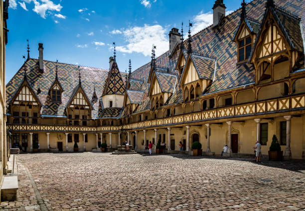 Courtyard and Burgundian tiled roof of the Hospice de Beaune taken in Beaune, Burgundy, France stock photo