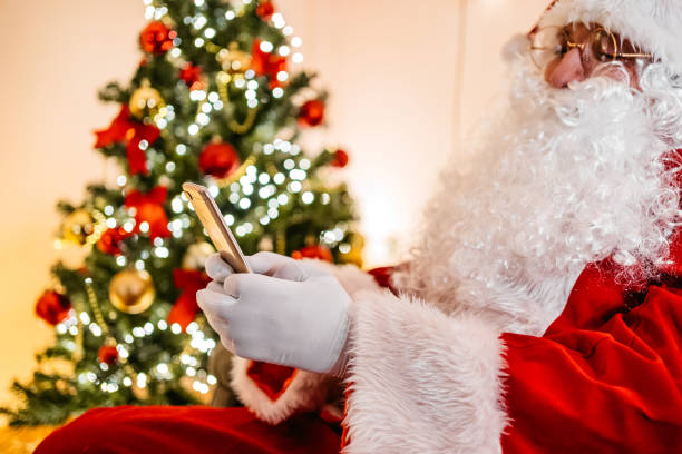 istock Santa Claus checking e-mails on phone 1277866615
