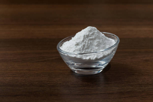 istock Baking soda (sodium bicarbonate) on dark wooden background. 1277870272