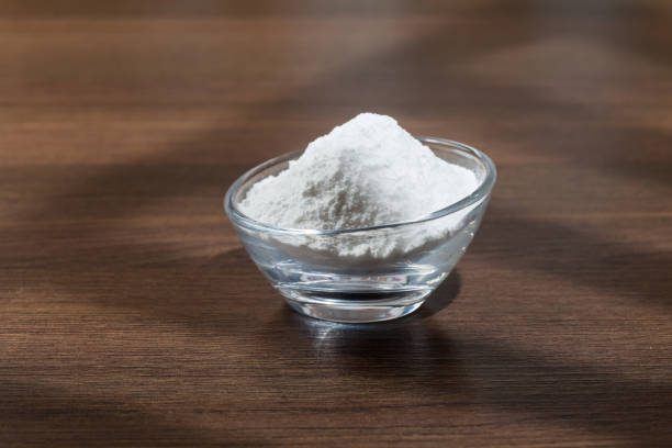 istock Baking soda (sodium bicarbonate) on dark wooden background. 1277870531