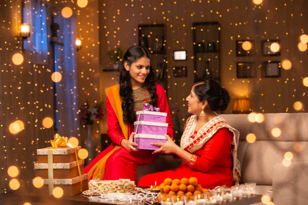 Mother and daughter diwali celebrate - stock photo Indian, Indian Ethnicity, Lifestyle, Festival, Indian Culture, mithai stock pictures, royalty-free photos & images