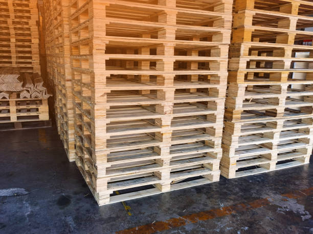 istock Worker driving forklift to loading wooden pallets from truck to warehouse cargo storage, shipment in logistics and transportation industrial, wood pallets stack, delivery service 1277875627