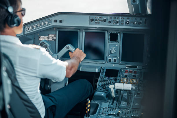istock Male professional in uniform driving passenger airplane 1277876764