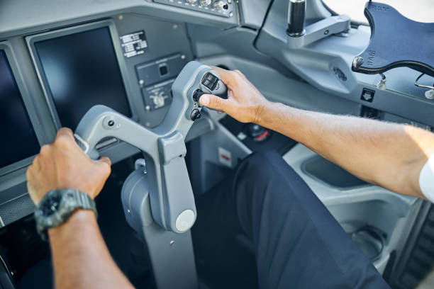 istock Male pilot in cockpit flying passenger plane 1277876775