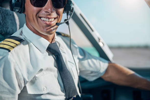 istock Happy young pilot ready for departuring from airport 1277876784