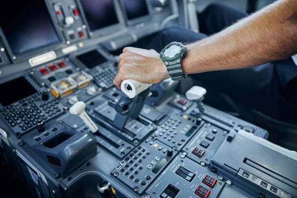 male professional pilot taking off passenger plane - airplane cockpit taking off pilot imagens e fotografias de stock