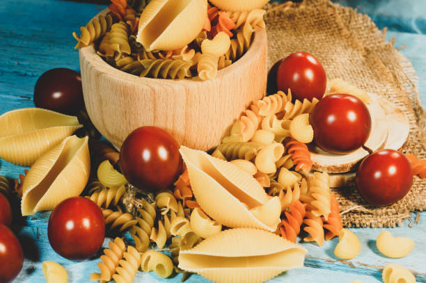istock Various kinds of pasta on a wooden background 1277876943