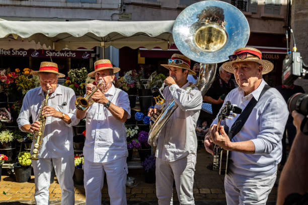 Street musicians playing  in French market taken in Beaune, Burgundy, France stock photo