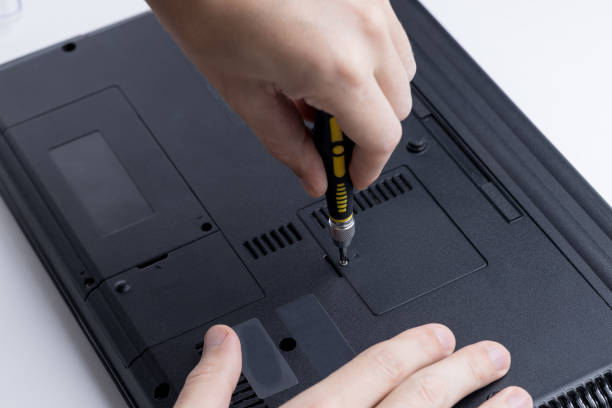 istock close up view for a technician worker repairing or adjusting laptop pc. person using work tool to open memory module socket. laptop and computer service conceptual 1277880729