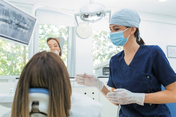 istock Female patient showing teeth 1277884419