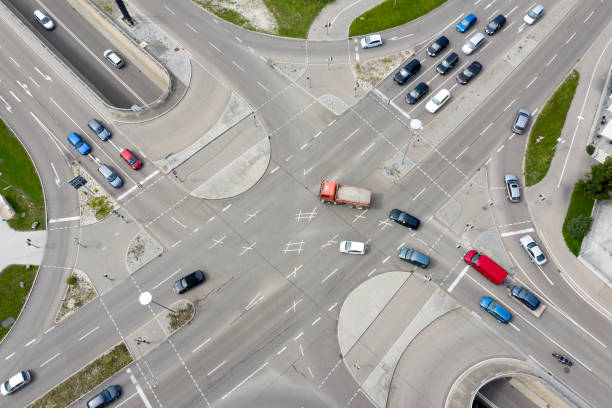 istock Road intersection with car traffic, aerial view. 1277893910