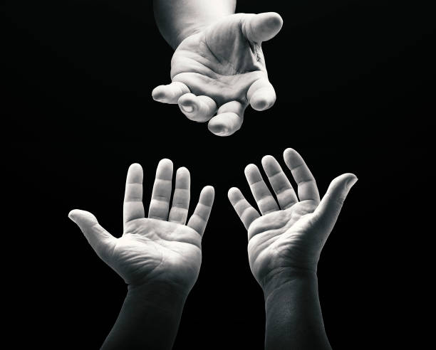 Worship God concept Black and white child reaching two hand to God on dark room background church black and white people praying stock pictures, royalty-free photos & images