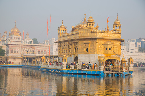 The Golden Temple is a gurdwara located in the city of Amritsar, Punjab, India. It is the preeminent spiritual site of Sikhism. It is one of the holiest sites in Sikhism, alongside the Gurdwara Darbar Sahib Kartarpur in Kartarpur, and Gurdwara Janam Asthan in Nankana Sahib.