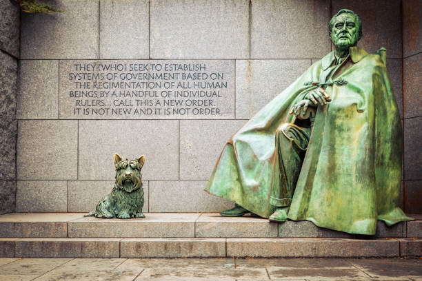 Fala and FDR Washington, District of Columbia / USA - February 24, 2018:  Fala, Franklin D. Roosevelt"u2019s dog sits next FDR at the Franklin Delano Roosevelt Memorial sculpted by Neal Estern and dedicated by President Clinton on  May 2, 1997. president photos stock pictures, royalty-free photos & images