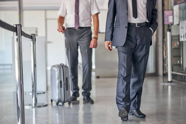 istock Businessman flying on trip with personal bodyguard 1277928566