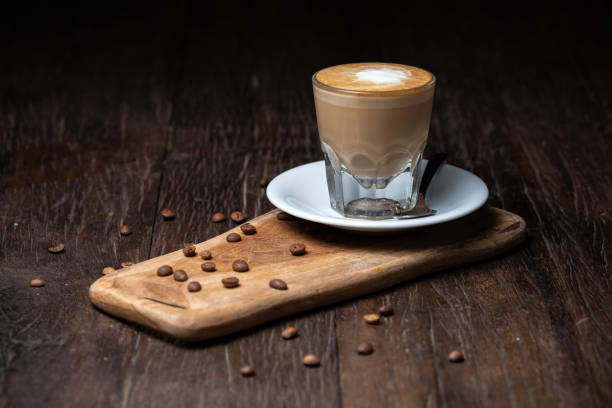 istock Coffee cup and beans on old kitchen table Cappuccino hot coffee with milk cup 1277944823