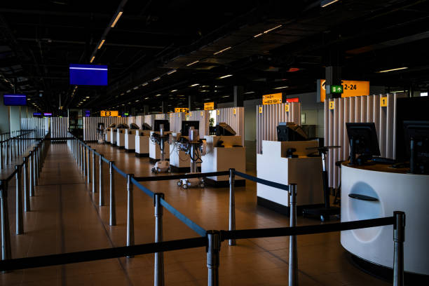 istock Empty check-in desks at Boarding gate at the airport 1277946129