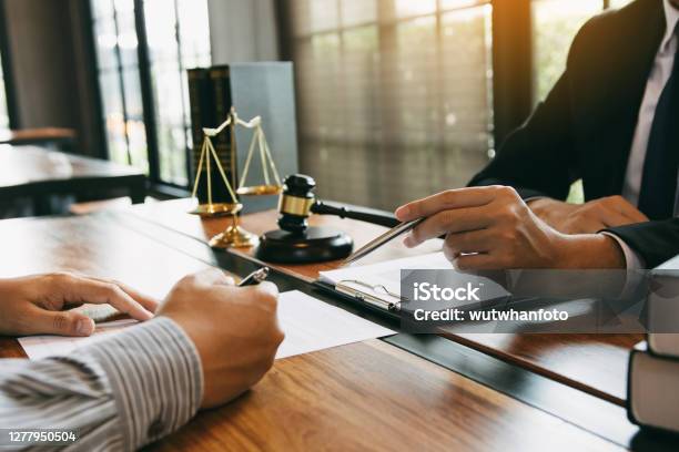 Lawyer Is Explaining About The Wrongdoing Laws Regarding Fraud To The Client At The Office Stock Photo - Download Image Now