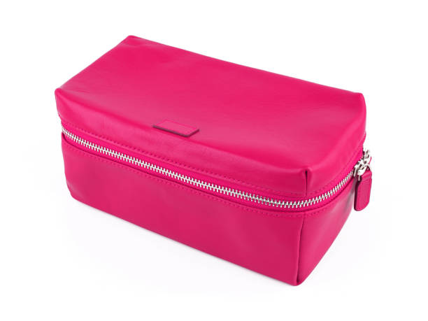 istock Female pink leather cosmetic bag isolated on white 1277951800