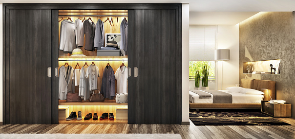 Modern bedroom with a large and beautiful wardrobe. Luxury and beautiful bedroom