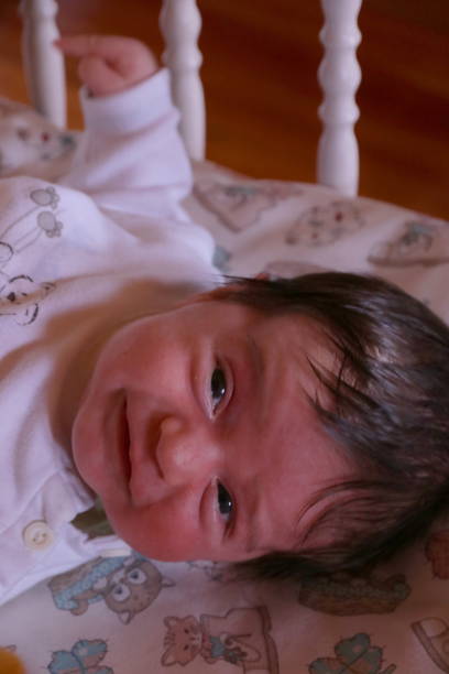 istock Cute baby boy looking at camera 1277958629