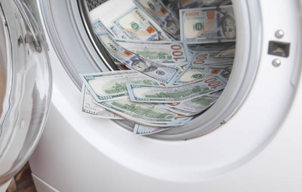 istock Hundred dollars in a washing machine. 1277959894