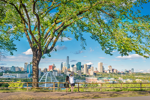 Couple enjoys the view of downtown Edmonton Alberta Canada on a sunny day.