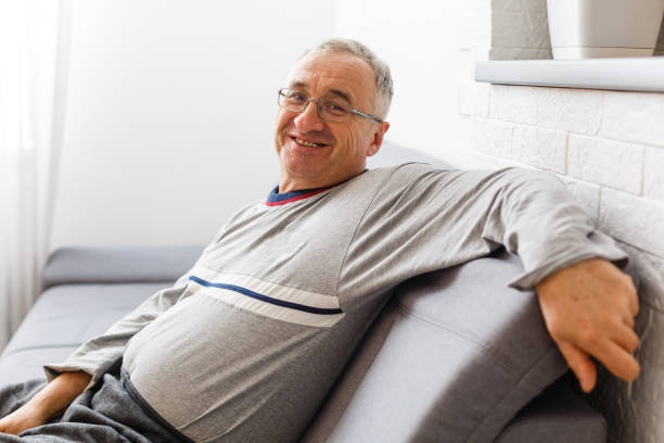 istock An elderly man sitting in a chair at his home, closeup with copy space 1277961184