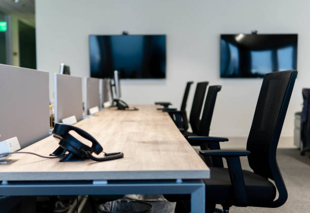 istock Empty Row of Office Chairs at a Desk Workstation 1277962967