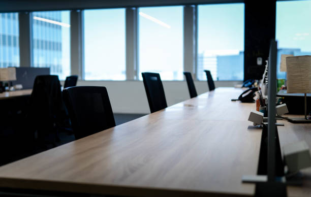 istock Empty Row of Office Chairs at a Desk Workstation 1277963428