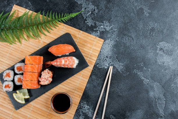 istock Sushi set. Japanese sushi, rolls, soy sauce, ginger, chopsticks 1277966712