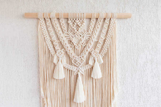 istock Macrame. Decoration for the interior. Interior design  with beige beautiful macrame wallhanding. Concept of cozy home decor. 1277966863