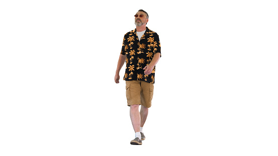 Wide shot. Front view. ool grandpa tourist walking and looking to the sides on white background. Professional shot in 4K resolution. . You can use it e.g. in your medical, commercial video, business, presentation, broadcast