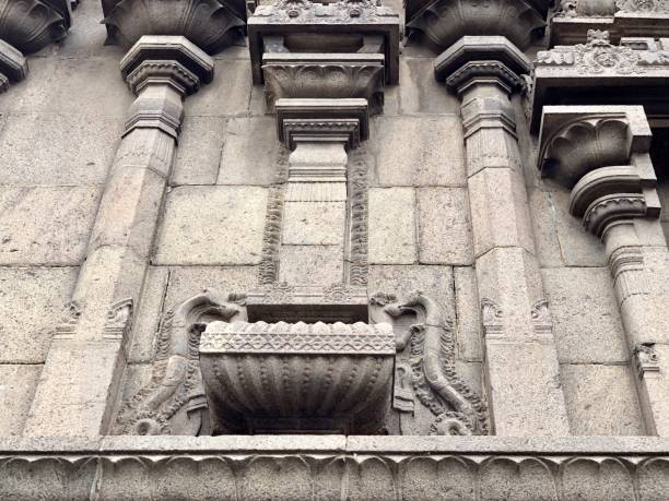 istock Stone wall decorations done in the outer walls of Kapaleeshwarar temple, Tamil nadu 1277971419