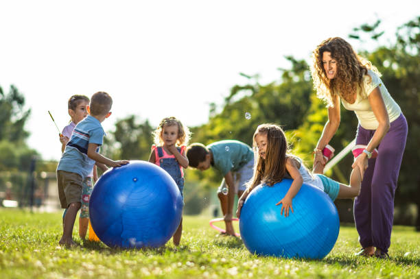 istock Group of kids playing in nature 1277972232