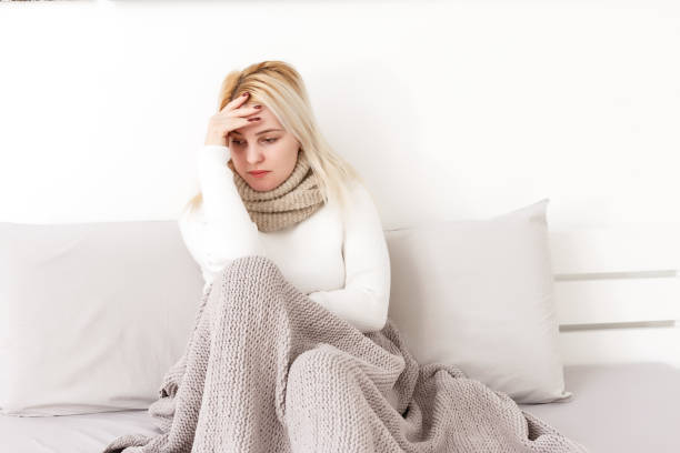 istock woman having headache with hands on temple. Copy space 1277973527